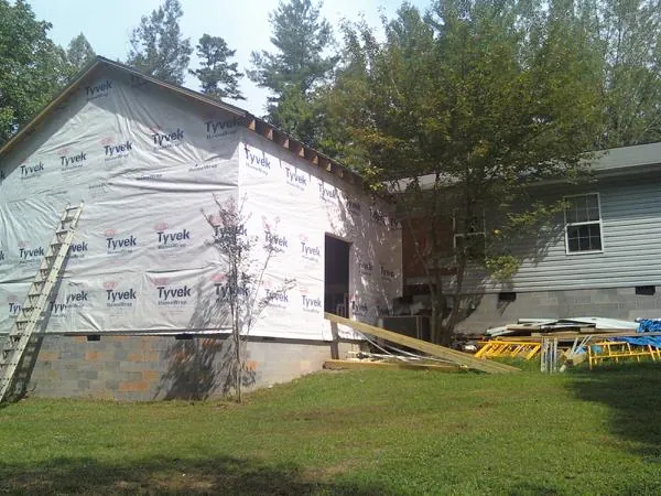 Tyvek wrapped gable on a new room addition beside an existing home in Montpelier Station
